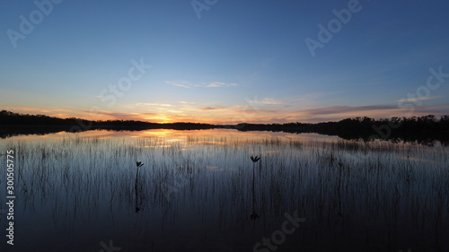 Sunrise cloudscape reflected on calm water of Nine Mile Pond in Everglades National Park  Florida.