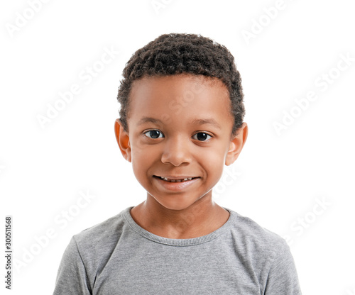 Cute African-American boy on white background