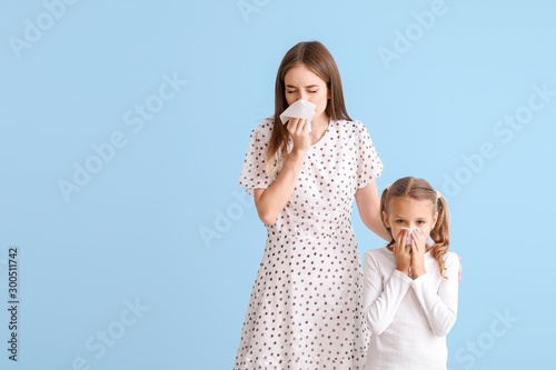 Young woman and little girl...