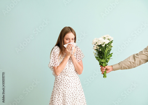Man giving flowers to young...