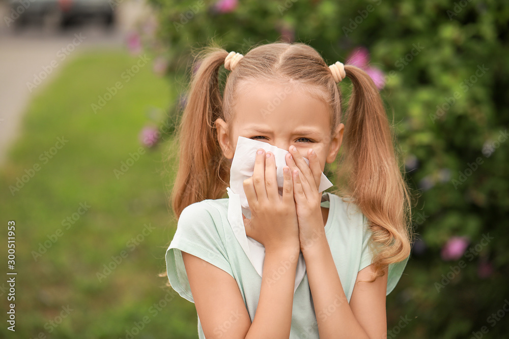 Little girl suffering from allergy outdoors Little girl suffering from allergy outdoors