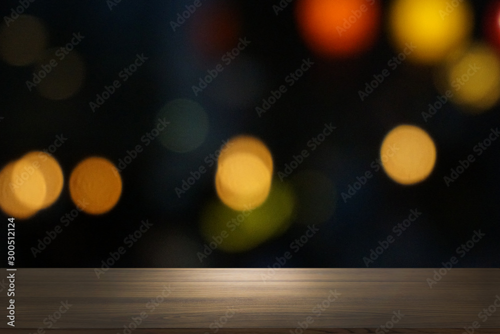 Empty dark wooden table in front of abstract blurred bokeh background of restaurant . can be used for display or montage your products.Mock up for space. Empty dark wooden table in front of abstract blurred bokeh background of restaurant . can be used for display or montage your products.Mock up for space.
