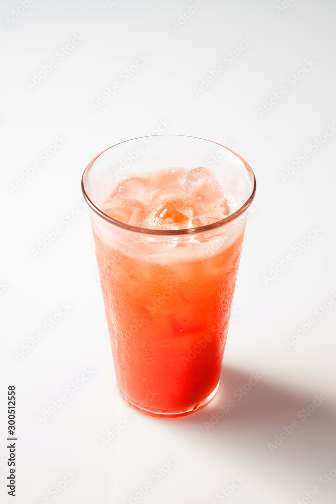 a watermelon juice with ice on a white background. a watermelon juice with ice on a white background.