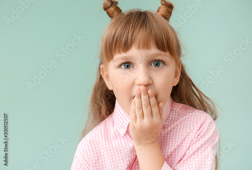 Surprised little girl on co...