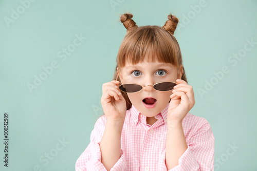 Surprised little girl on co...