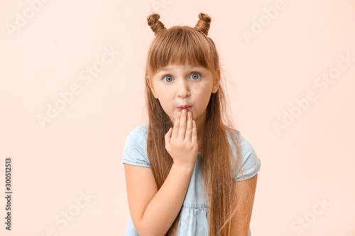 Surprised little girl on co...