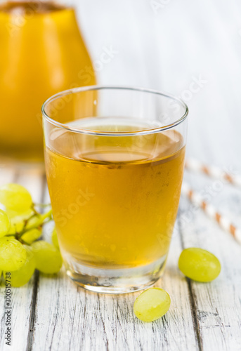 Grape Juice (fresh) as detailed close-up shot, selective focus)