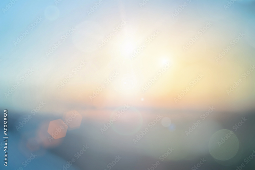 Natural background blurring warm colors and bright sun light. Bokeh or Christmas background Green Energy at sky sunny color orange light patterns plain abstract flare evening clouds blur. - obrazy, fototapety, plakaty 