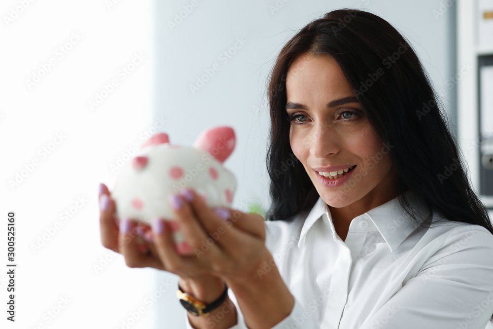 Smiling woman with ceramic figure Smiling woman with ceramic figure