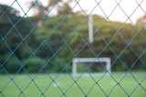 Football field and netting with evening light