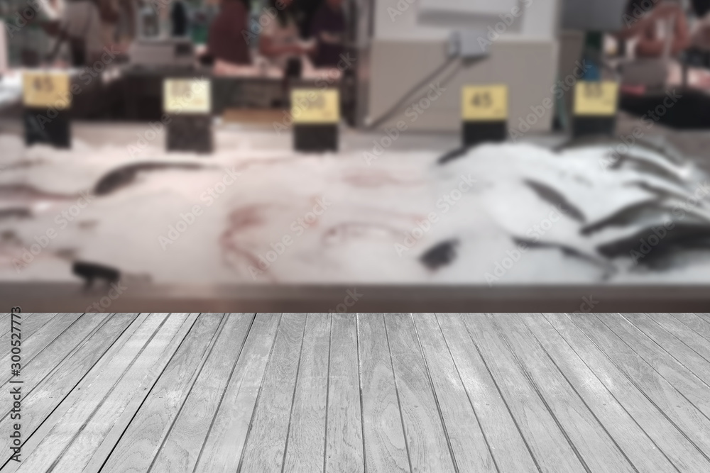 Wooden table with shopping mall blurred background Wooden table with shopping mall blurred background