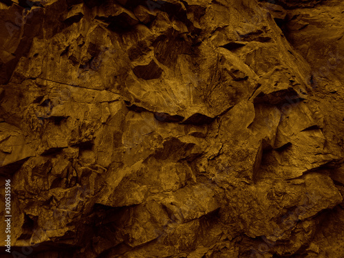 Abstract red grunge background. Rock texture. Mountain close-up. Dark brown stone backdrop. Toned red mountain texture.