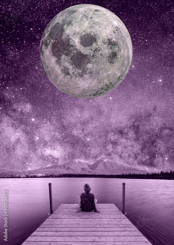 Fantastic night starry sky. Girl watching the stars and moon