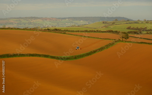 Tractor ploughing agricultural field in west Dorset