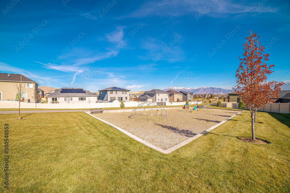 Fototapeta premium Kids playground on a housing development near sunset