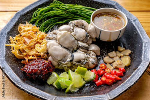 Oysters,Spicy Oyster Salad,Yum, Oyster and side dishes in Thai style, Thai style oysters with spicy dipping sauce