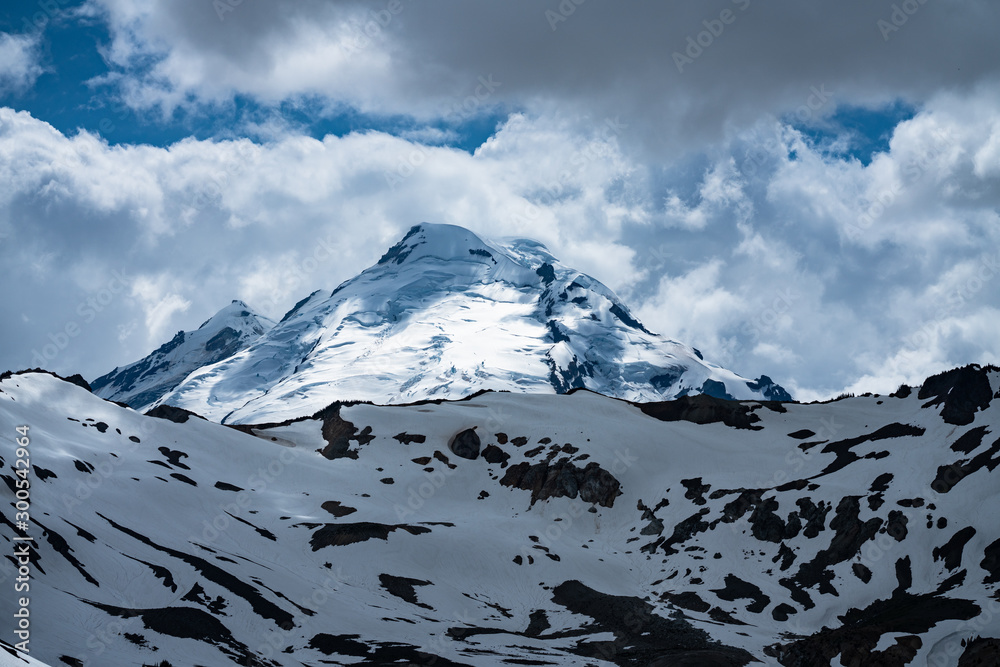 Snowcapped mountains landscape  with blue sky and clouds.  Mt Baker, Washington, USA