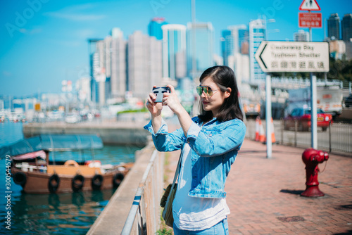 Girl traveling in Hong Kong Causeway Bay waterfront. © YiuCheung