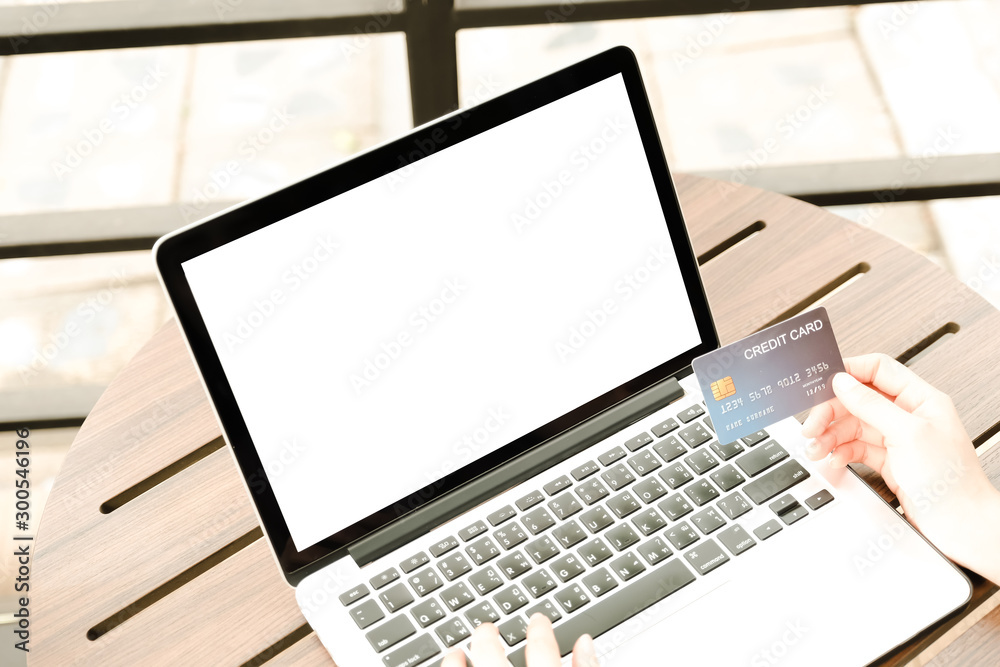 Laptop blank for mockup ecommerce concept with paying money by use credit card Laptop blank for mockup ecommerce concept with paying money by use credit card