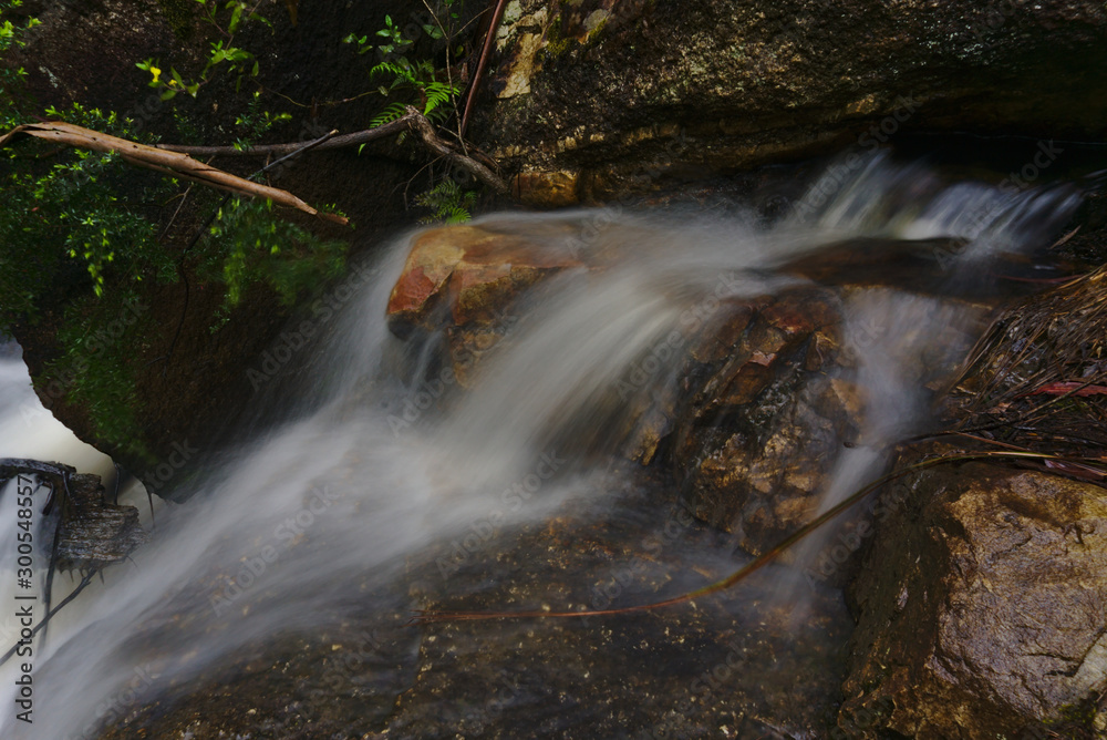 Streaming water of creek captured in long exposure