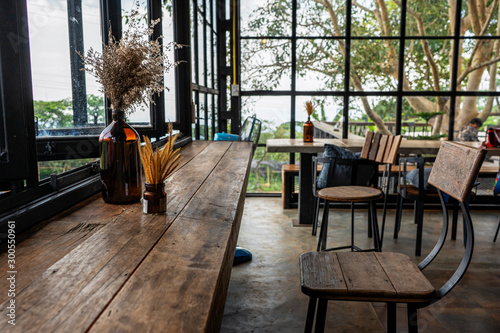  The atmosphere in the cafe is comfortable. ,Interior of cozy restaurant. Contemporary design in loft style, modern dining place and bar counter, copy space
