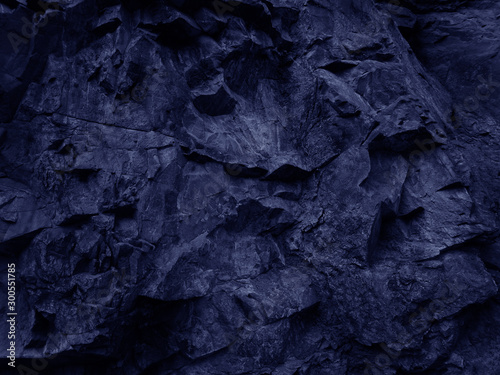 Abstract blue grunge background. Navy blue rock texture. Mountain close-up. Stone background for your design. Toned blue mountain texture. Monochrome.Bright abstract grunge background.