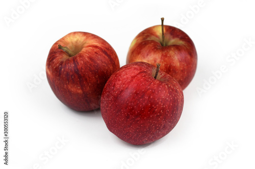 Group of natural unwaxed organic red apples on white background