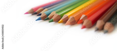 Colorful colored pencils close up, art supplies for painting education in classroom, kids stationary in school on white background, rainbow unicorn color, diversity,happy life, gay pride, lgbt concept