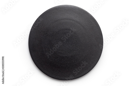 Empty black plate on white background. Top view.