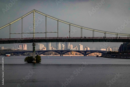 Kiev, Ukraine The Pishokhidnyy Mist Cherez Dnipro bridge on the Dnieper river. photo