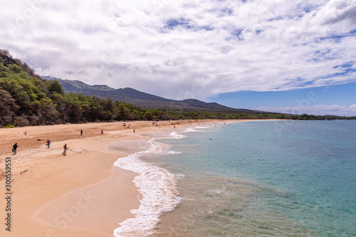 Wailea, Maui \ Hawaii - 29 July 2019: Panoramic view at Big Beach. People enjoy sunny day at a long sand beach of Wailea-Makena area. photo