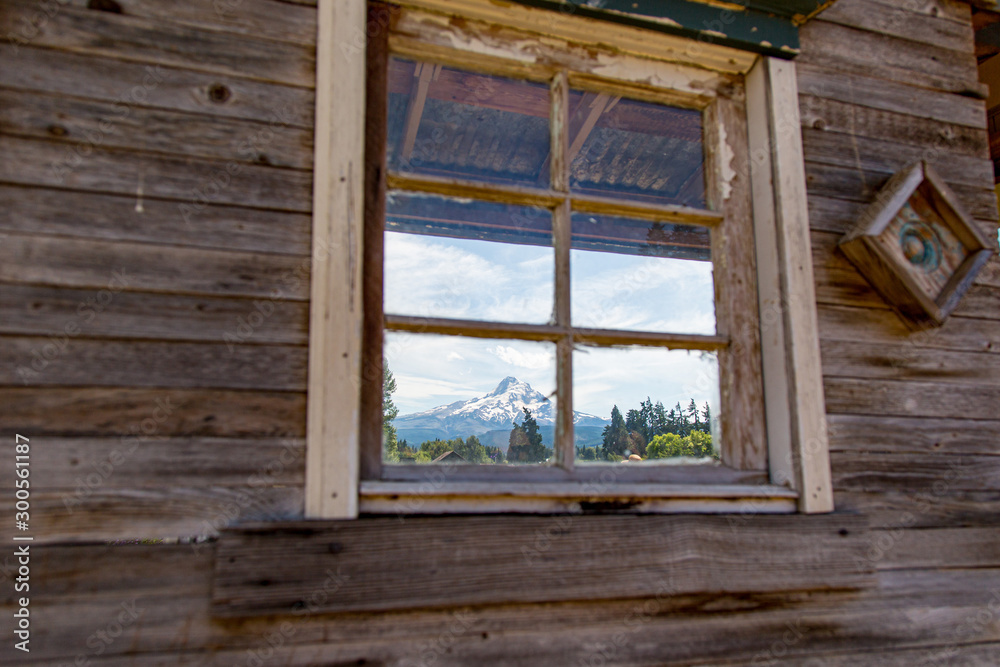 Looking through an old small wooden house window at Mt Hood, Oregon Looking through an old small wooden house window at Mt Hood, Oregon