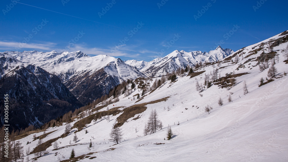Winter landscape - Panorama of the ski resort with ski slopes and ski lifts. Alps. Austria. Karnten