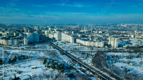 Top view of city in winter at sunset on sky background. Aerial drone photography concept. Kishinev, Republic of Moldova.