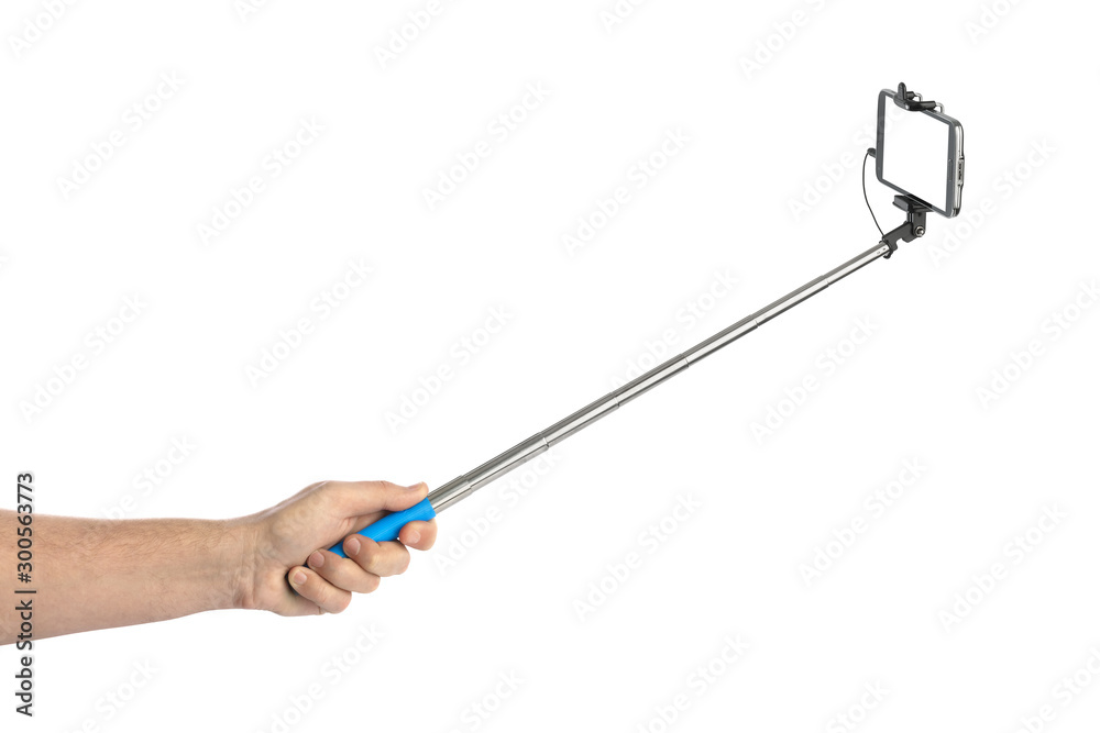 Fototapeta premium Hand and smartphone with selfie stick