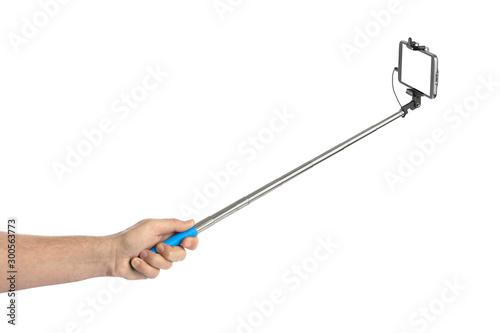 Hand and smartphone with selfie stick