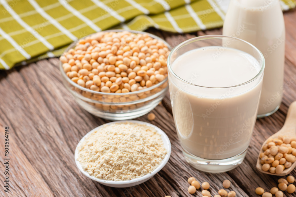 Homemade Soy milk and Soybean with Soy flour on wooden background, Healthy drink. Homemade Soy milk and Soybean with Soy flour on wooden background, Healthy drink.