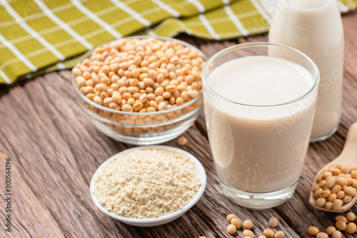 Homemade Soy milk and Soybean with Soy flour on wooden background, Healthy drink.