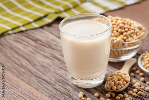 Homemade Soy milk and Soybean on wooden background, Healthy drink.