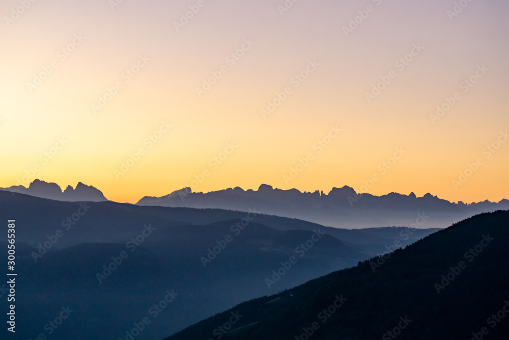 Panoramic of glowing mountain ridge during sunset