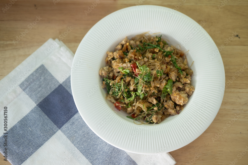 Stir fried vermicelli with minced pork and Cha-om leave. Stir fried vermicelli with minced pork and Cha-om leave.