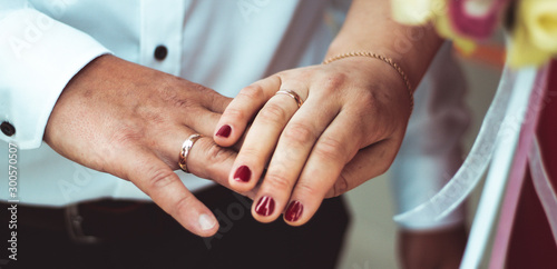 Wife and husband showing their rings.