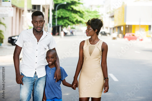 Family walking on the street photo