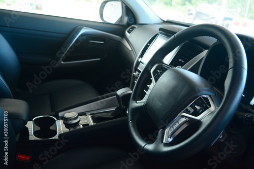 the black leather at middle of the steering wheel inside of new car passenger room © Onnada