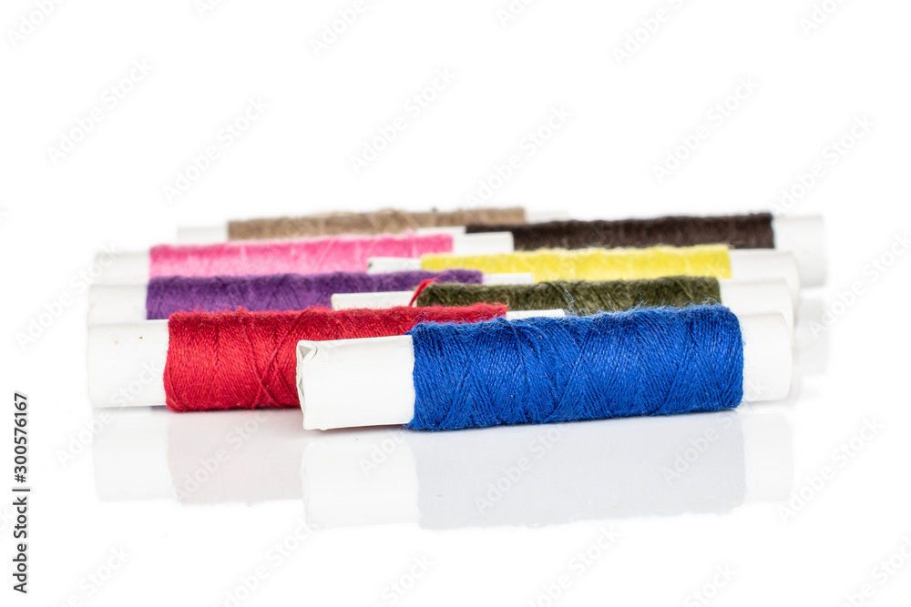 Group of eight whole arranged sewing thread spool isolated on white background Group of eight whole arranged sewing thread spool isolated on white background