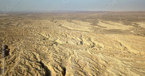 Aerial view over large Wadi with Soft sedimentary rock, Arava Desert Drone footage view over Wadi Amatzia Soft sedimentary rock, Arava Valley Isael photo