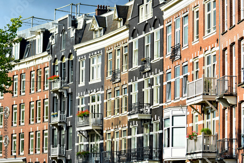 facades of residential buildings on a city street, Europe, Ams terdam