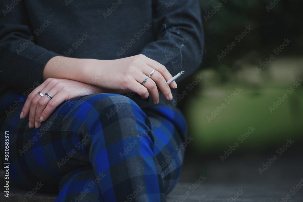 girl holding a cigarette