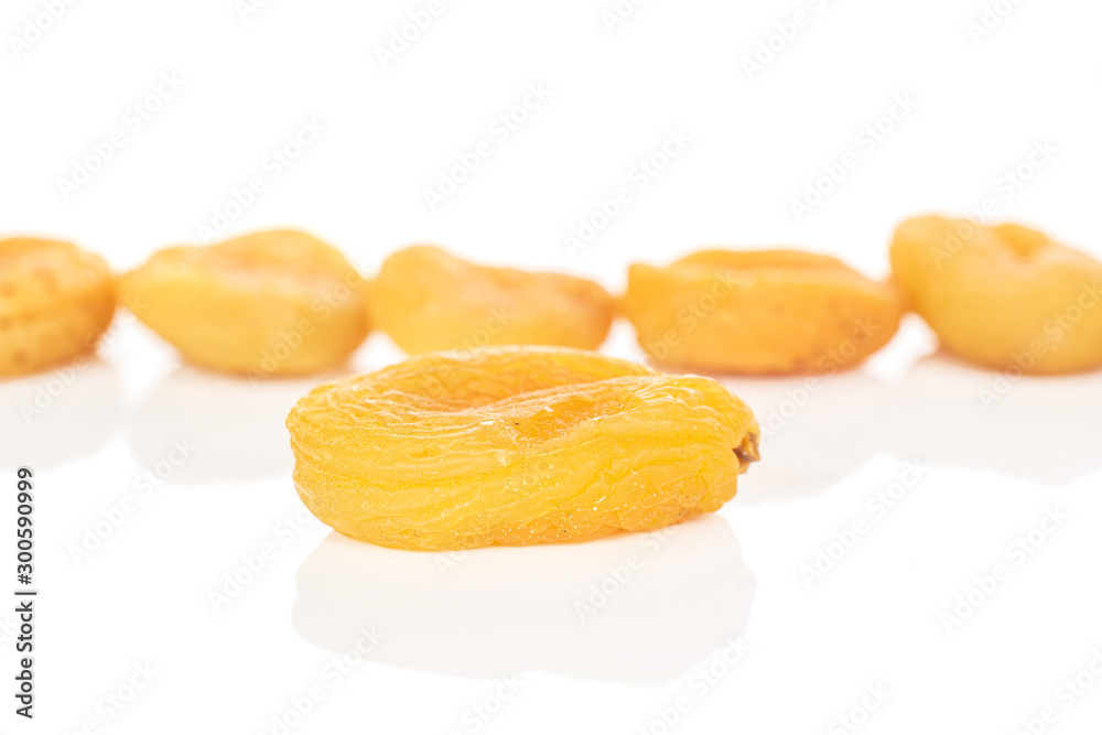 Group of six whole dried orange apricot one in focus isolated on white background Group of six whole dried orange apricot one in focus isolated on white background