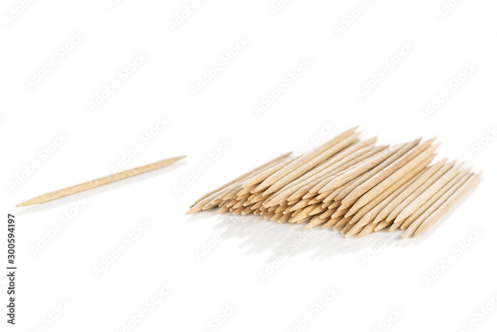 Lot of whole wooden brown toothpick heap isolated on white background Lot of whole wooden brown toothpick heap isolated on white background